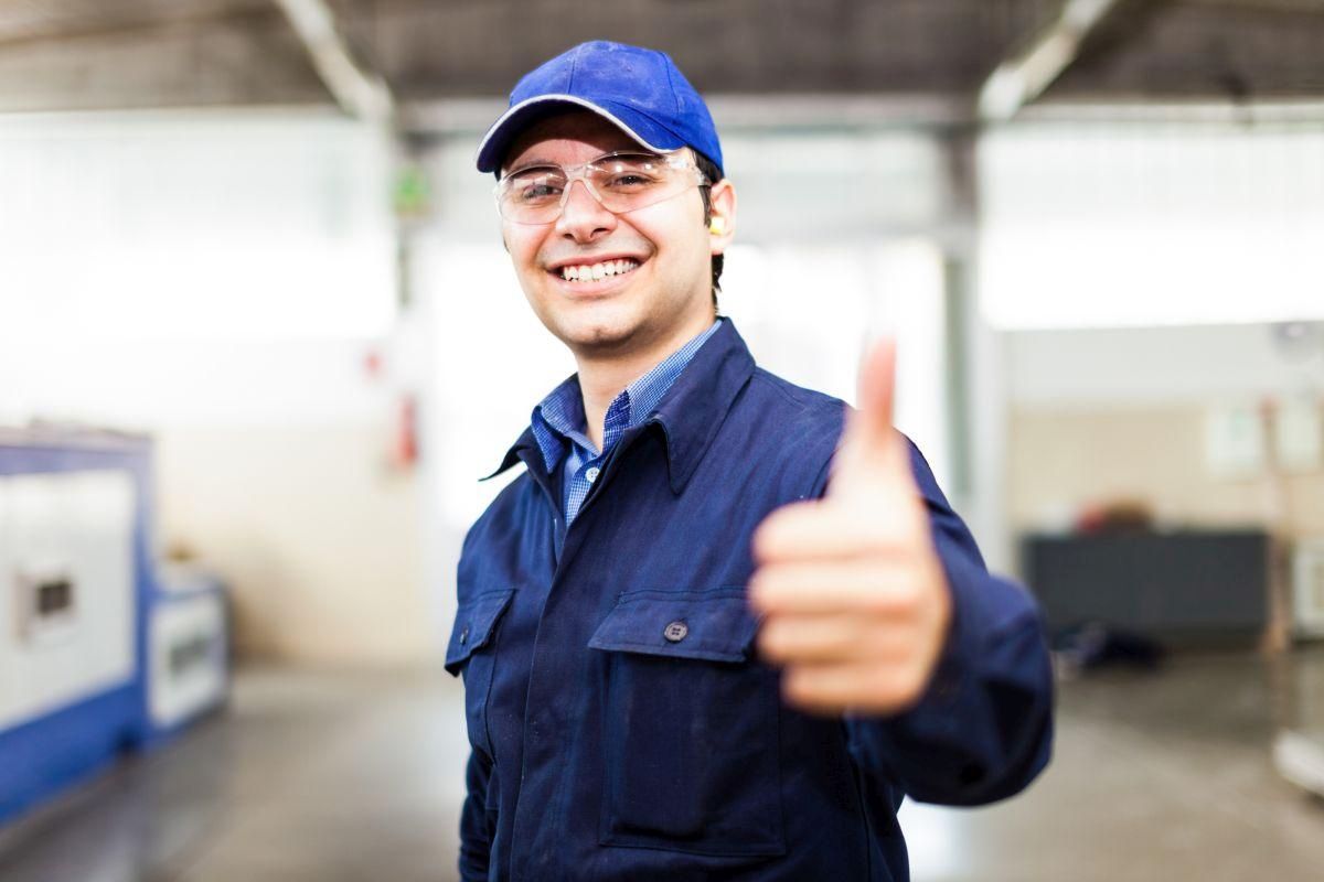 Portrait of a smiling worker in a factory